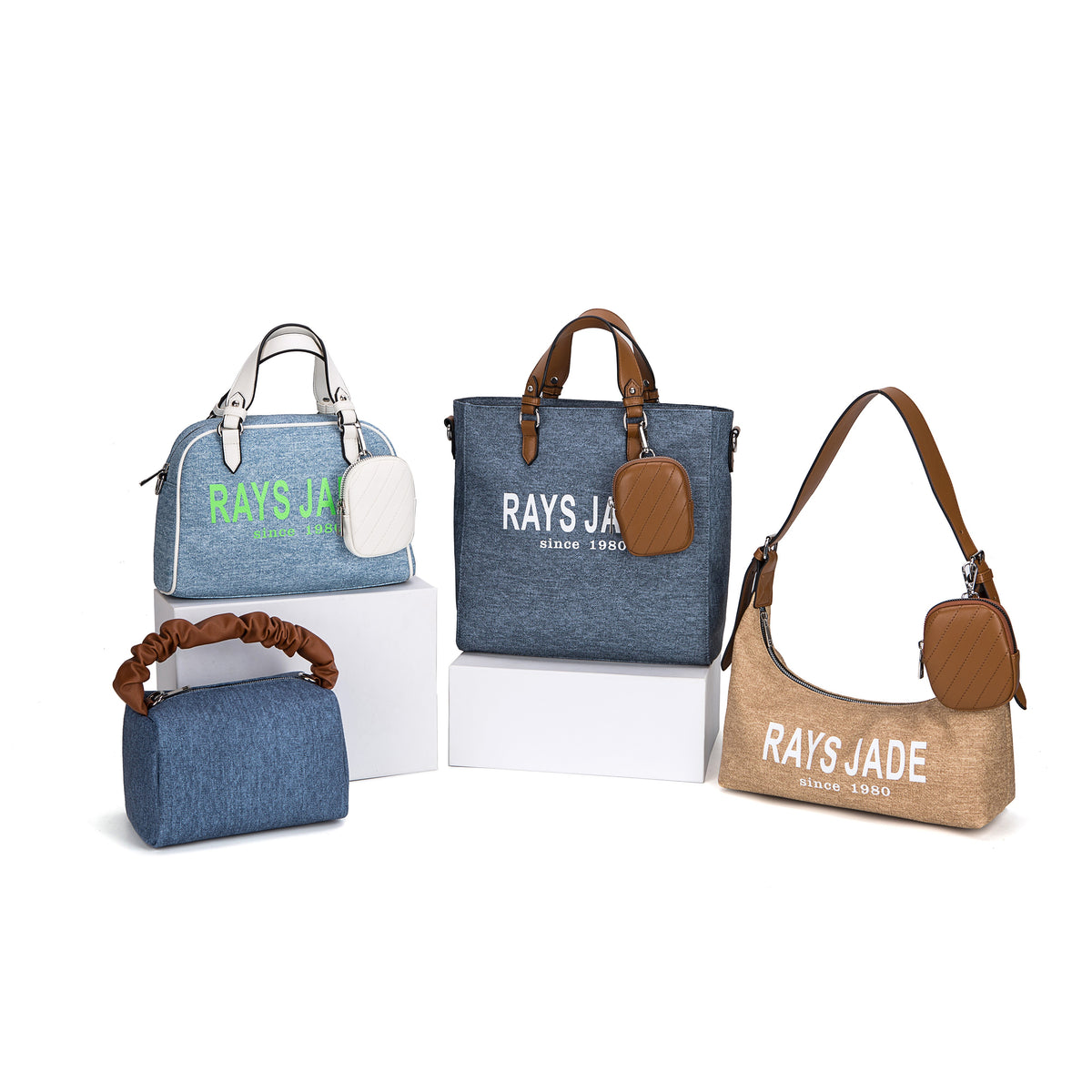 Blue denim-look and tan bags with contrast handles, lettering and small pouches