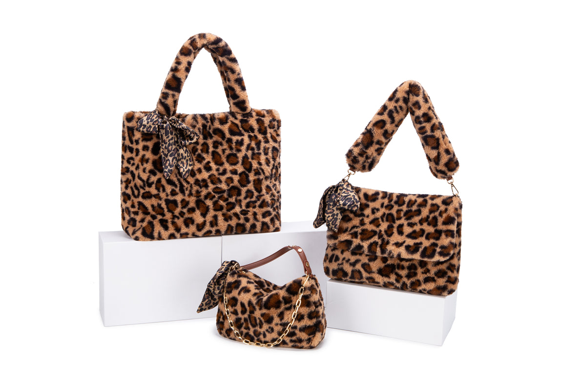 Leopard-pattern tote and shoulder bags with plush-looking surfaces and scarf bows