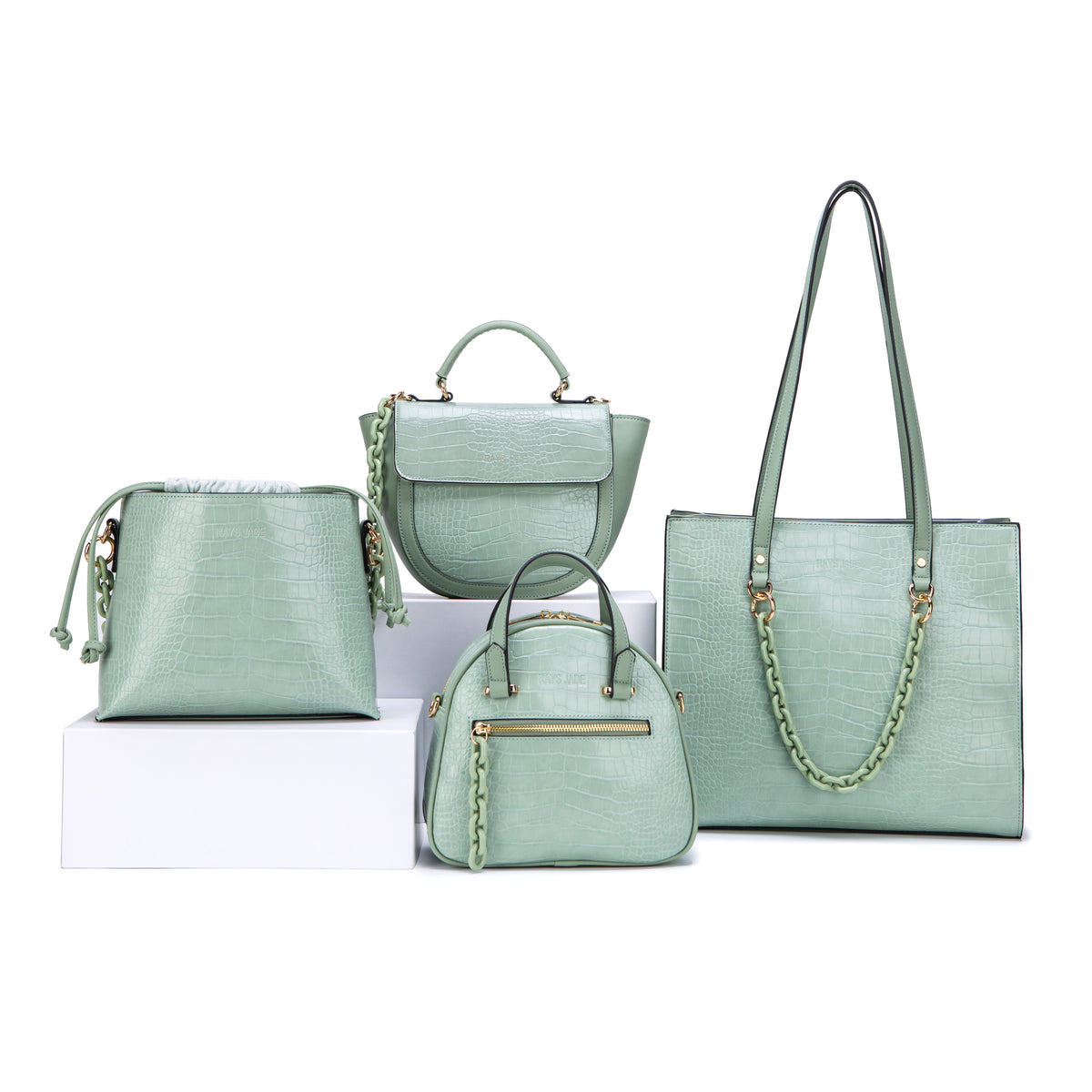 Mint croc-effect tote, bucket and top-handle bags with matching chain details
