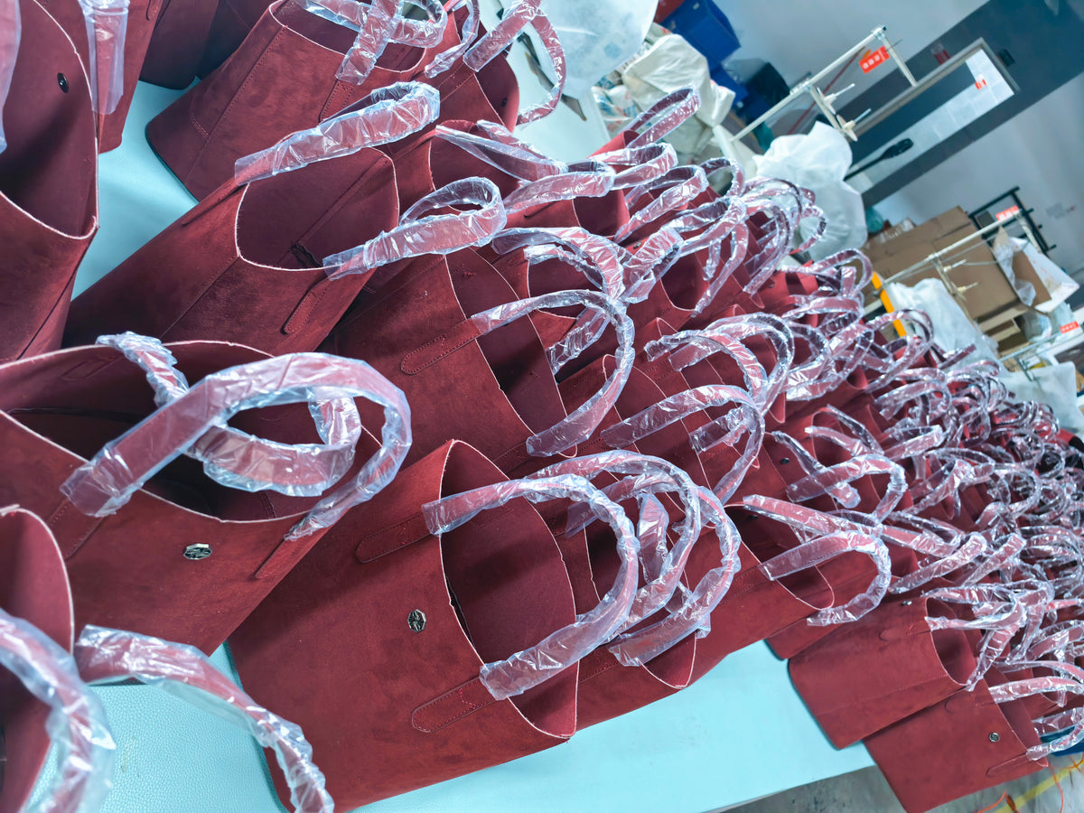 Burgundy totes in production in the Sunchain photo collection