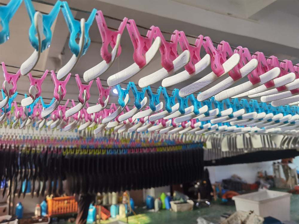 White handbag handles hanging during production