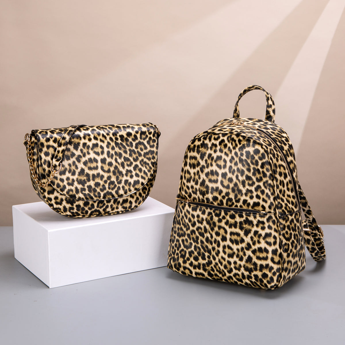 Leopard-pattern flap shoulder bag and backpack with zip and chain details