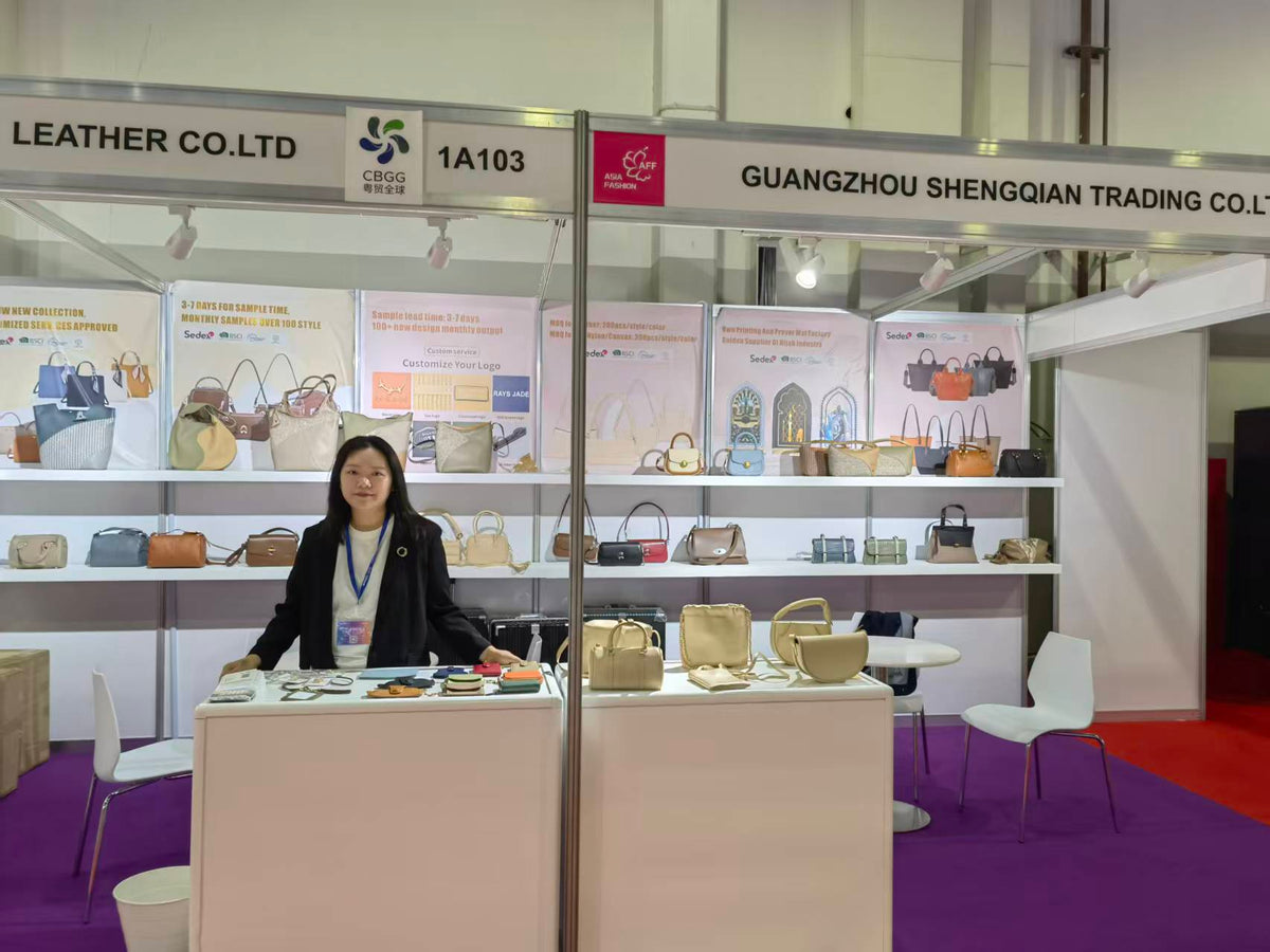 Small handbags and accessory samples displayed on counters and wall shelves.